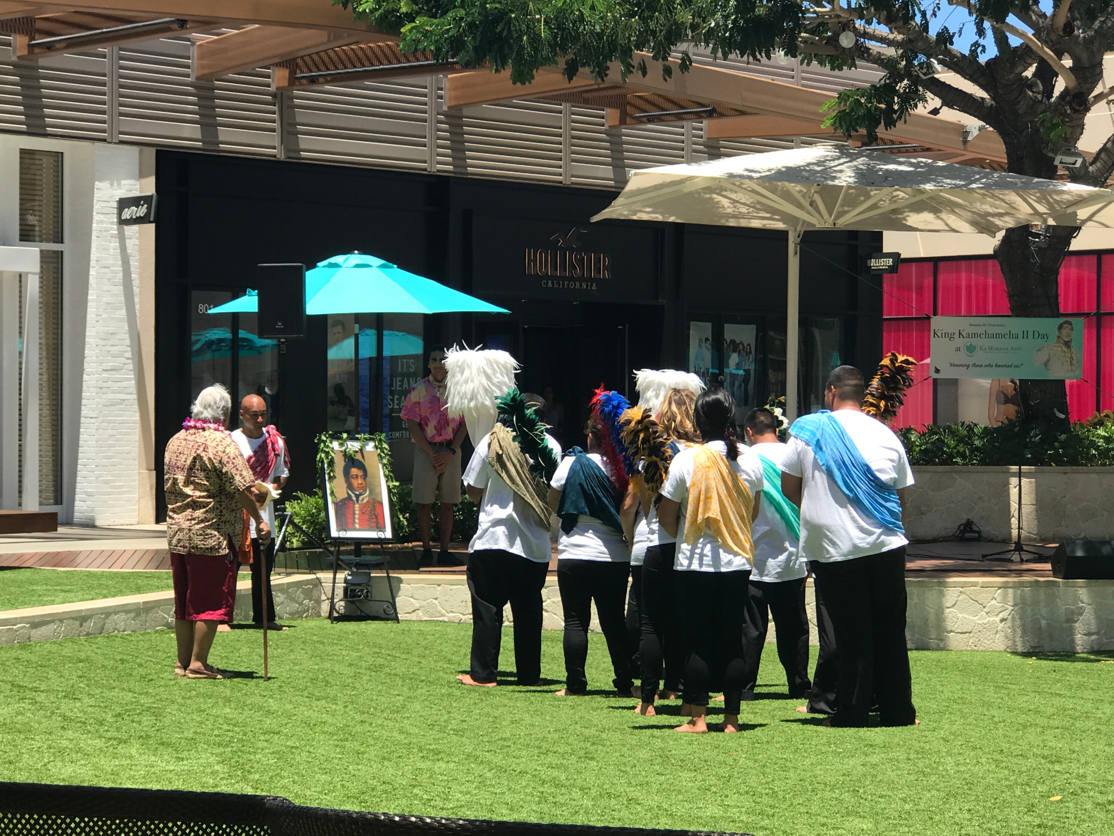 Outdoor community gathering on lawn at Ka Makana Aliʻi