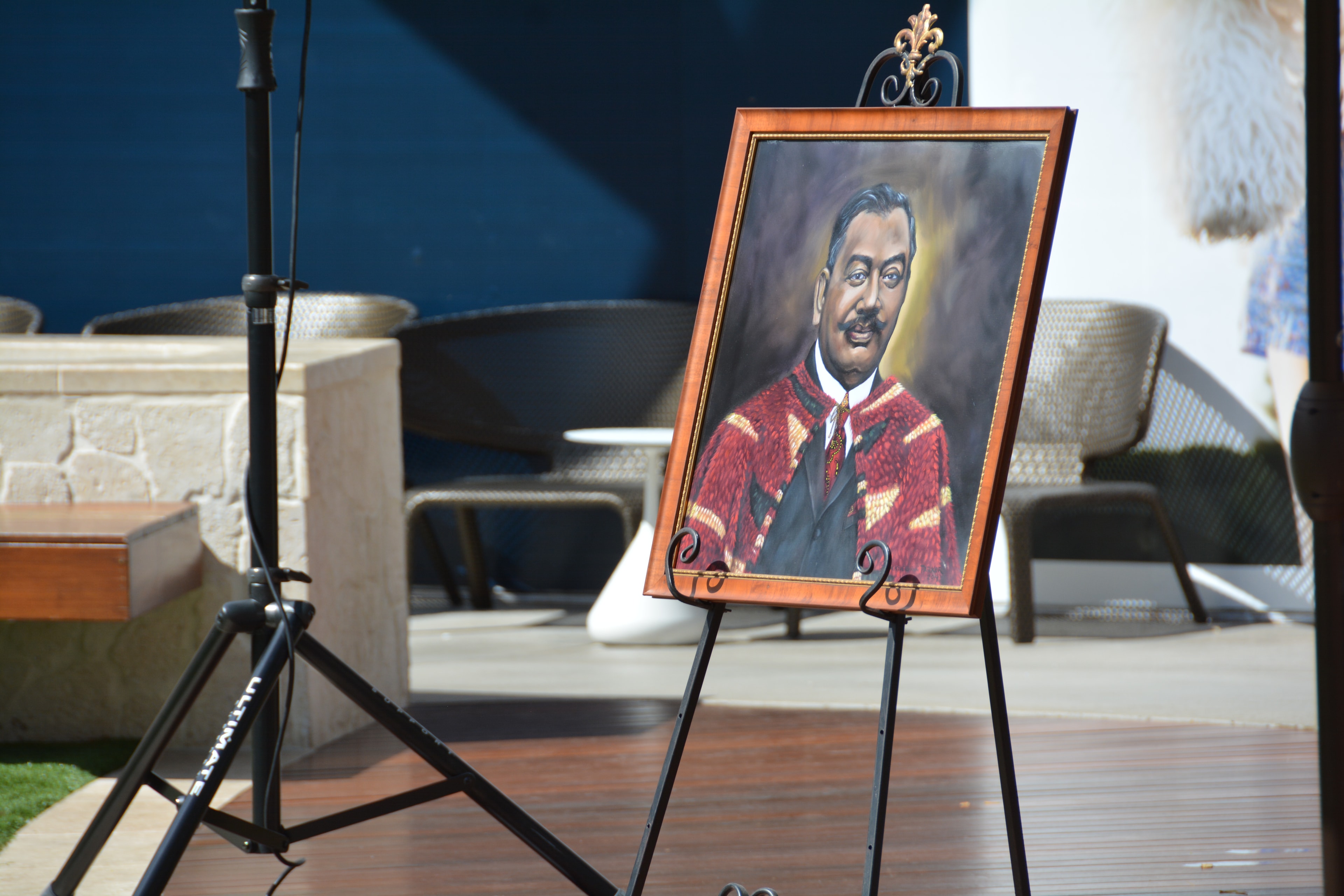 Portrait painting on easel outdoor display
