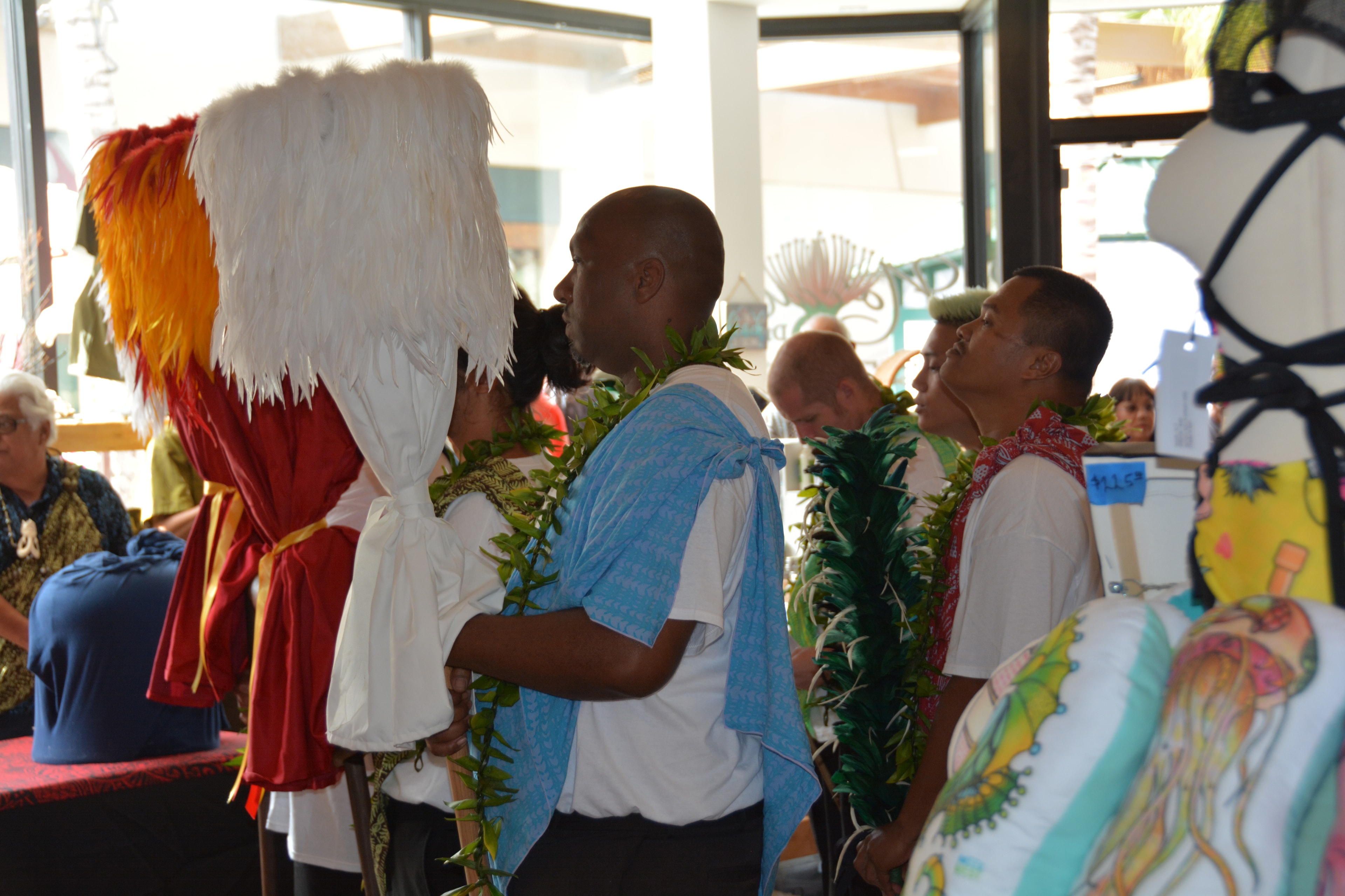 People wearing angel wings at community event