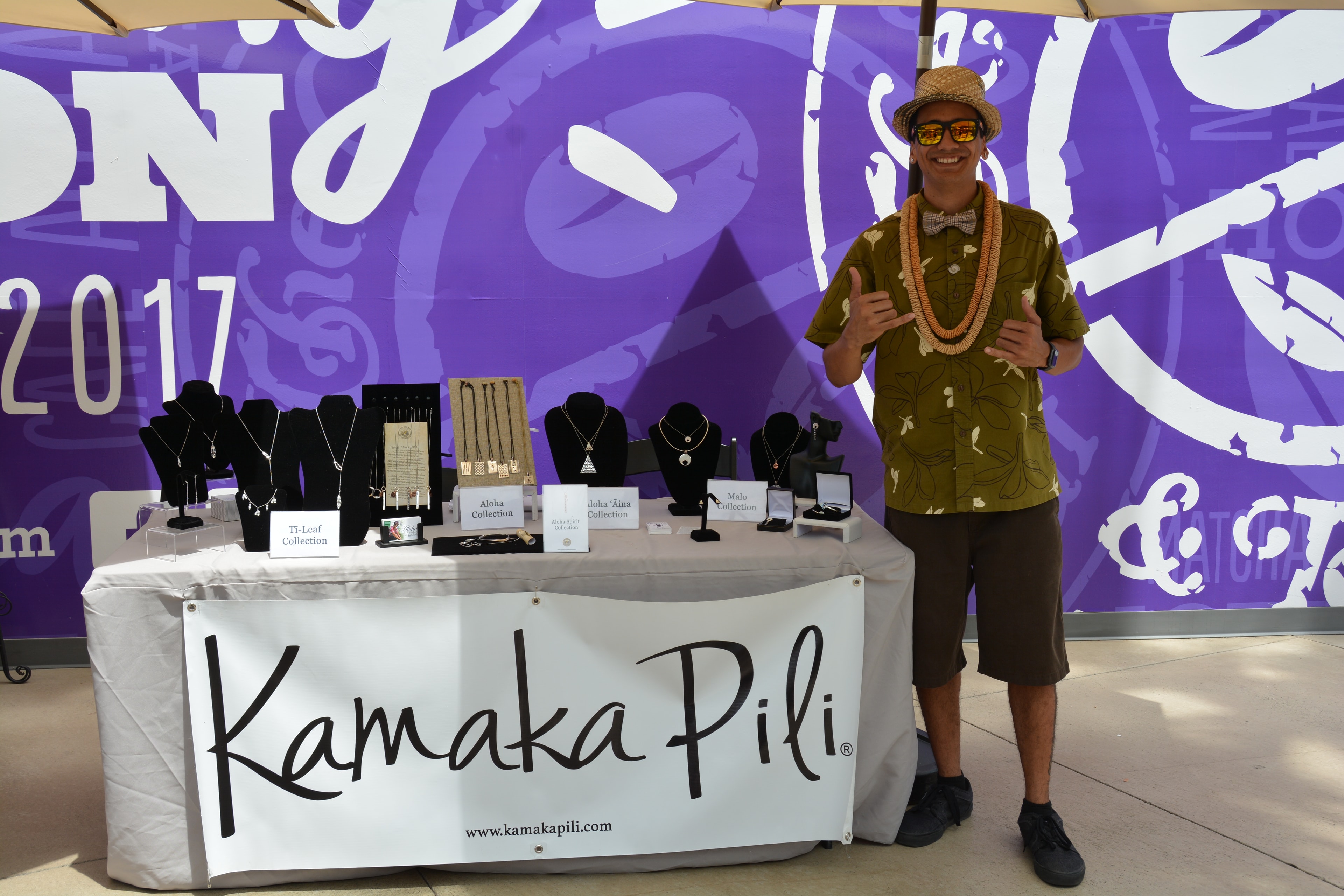Vendor displaying Kamaka Pili jewelry collection