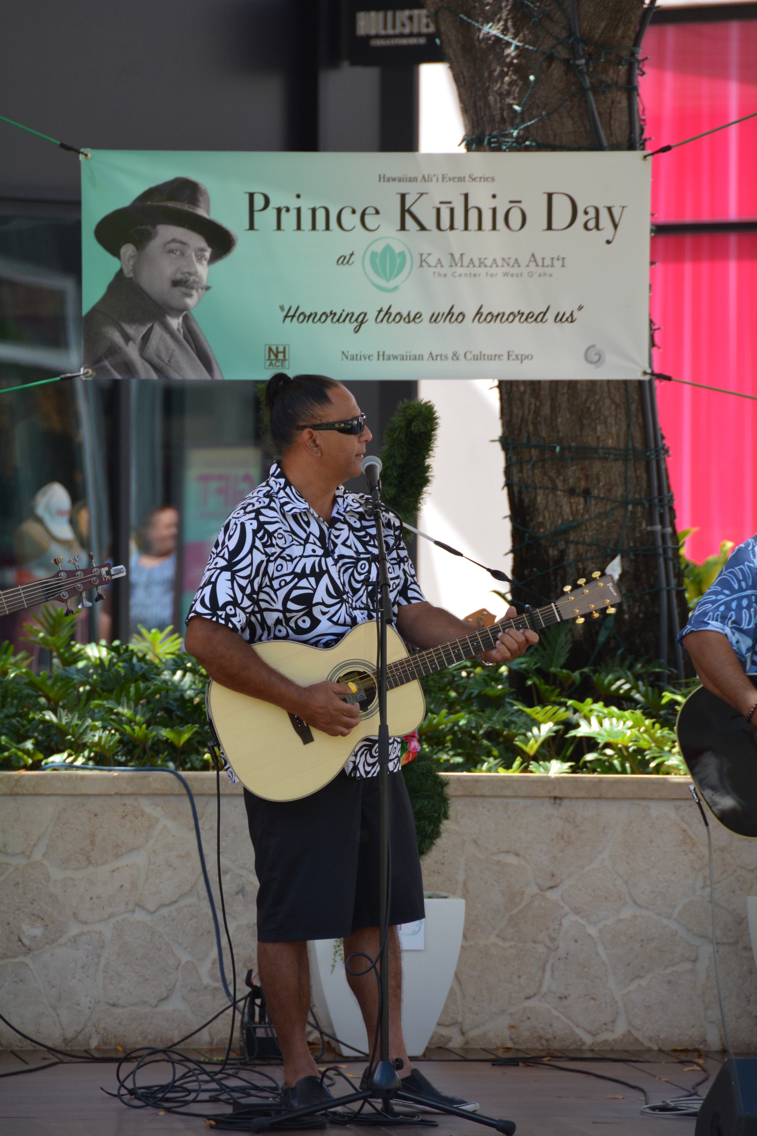 Musician performing at Prince Kūhiō Day event