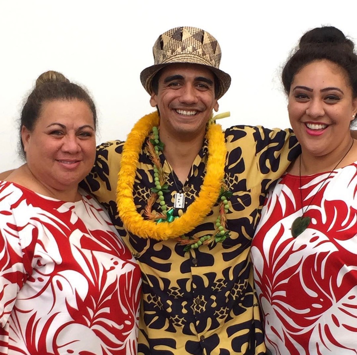 Three people Hawaiian themed party costumes