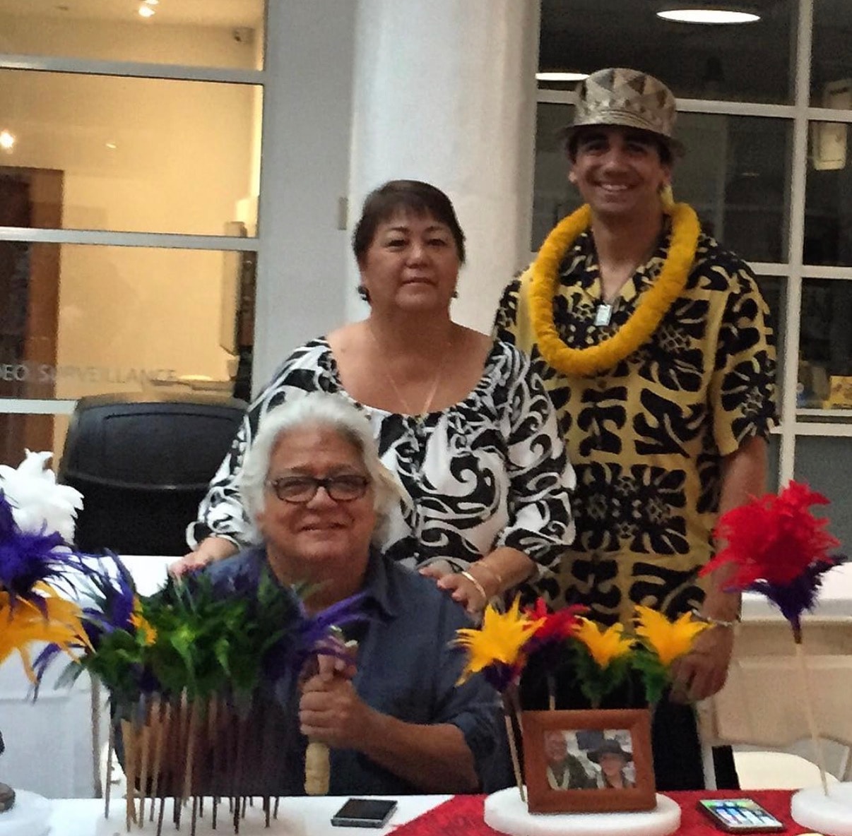 Three people Hawaiian party celebration indoors