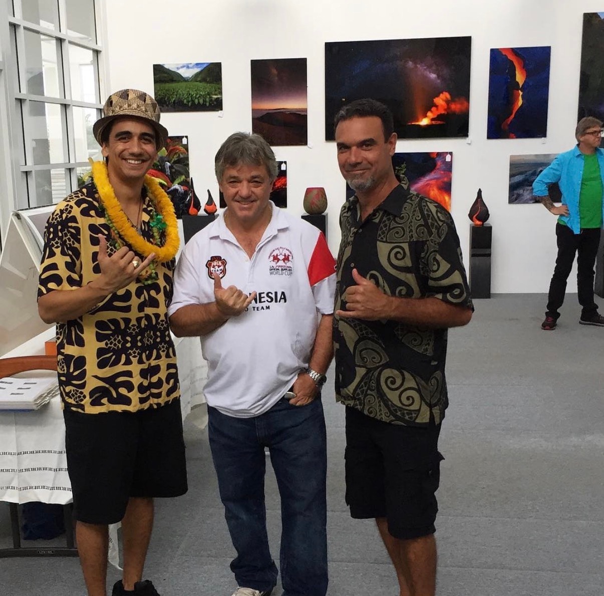 Men posing at volcano photography exhibition