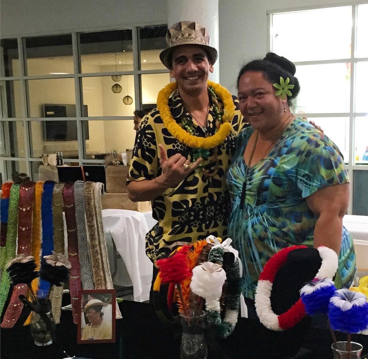 Two people wearing tropical costumes at craft fair