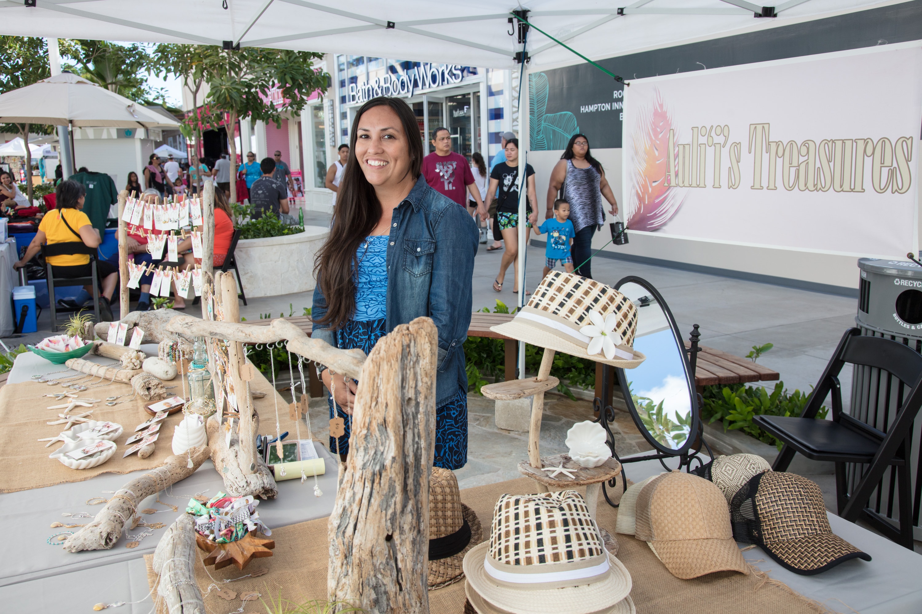 Woman selling handmade jewelry at outdoor market