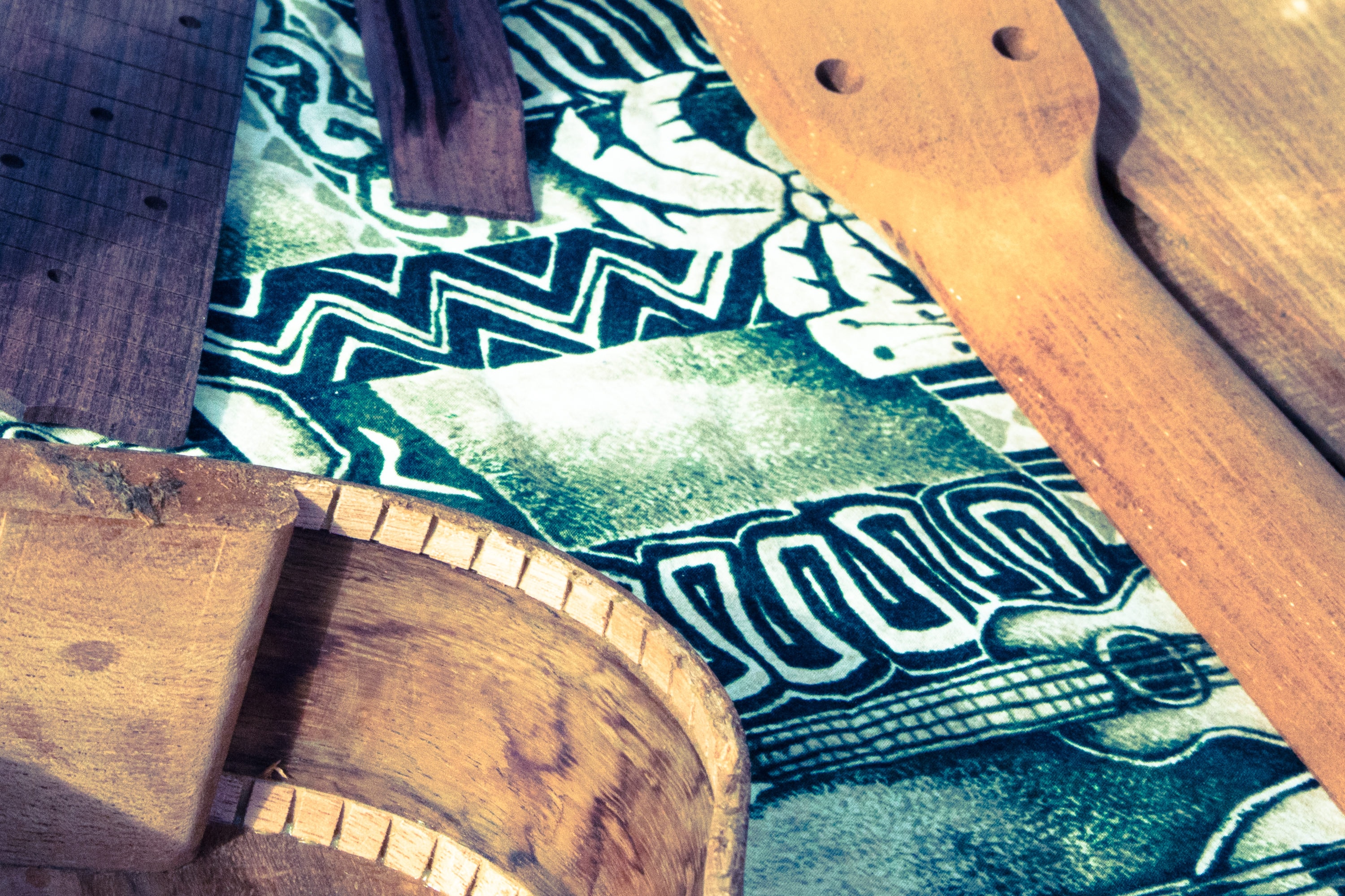 Wooden instruments with patterned fabric detail
