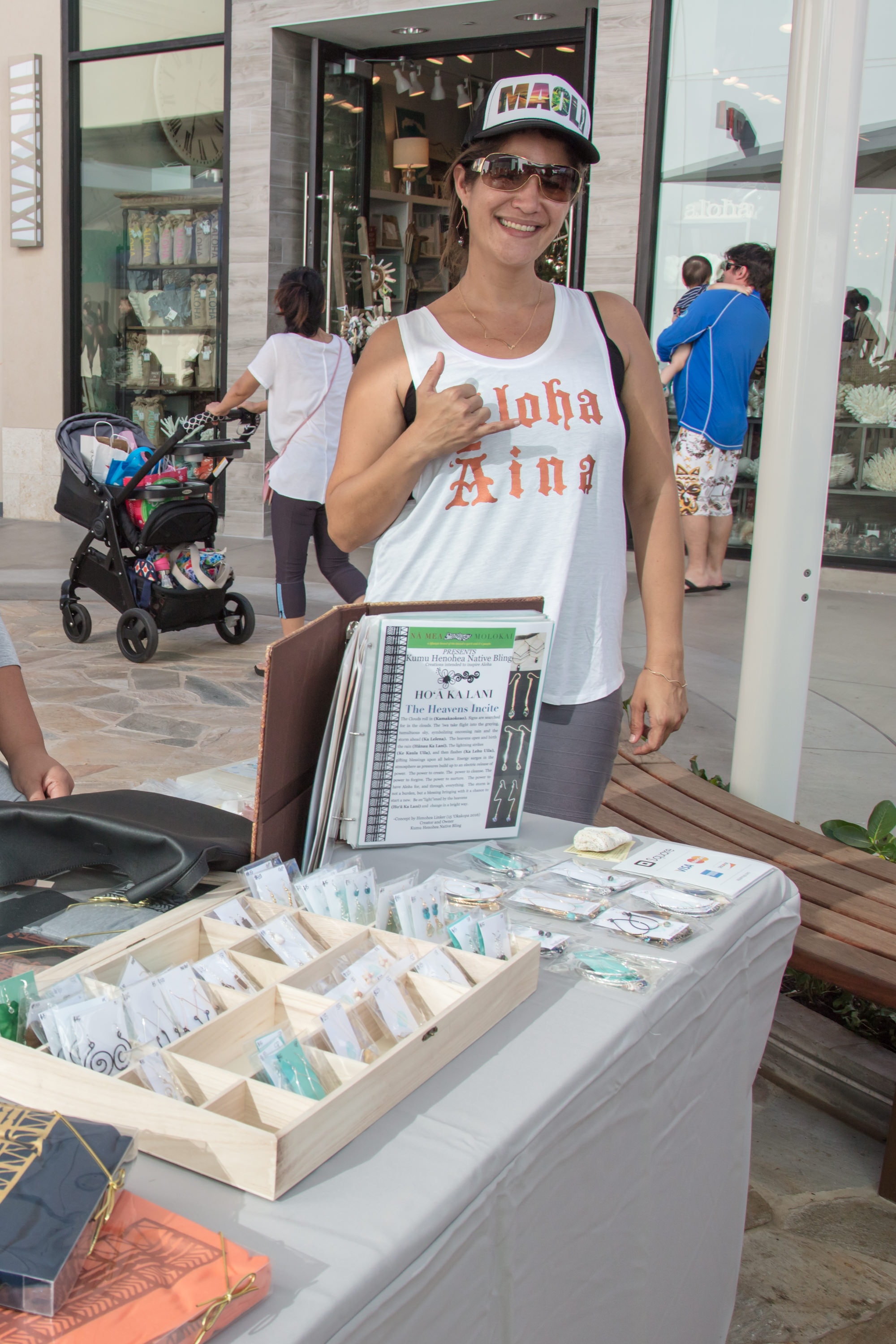 Woman selling Hawaiian crafts at outdoor market