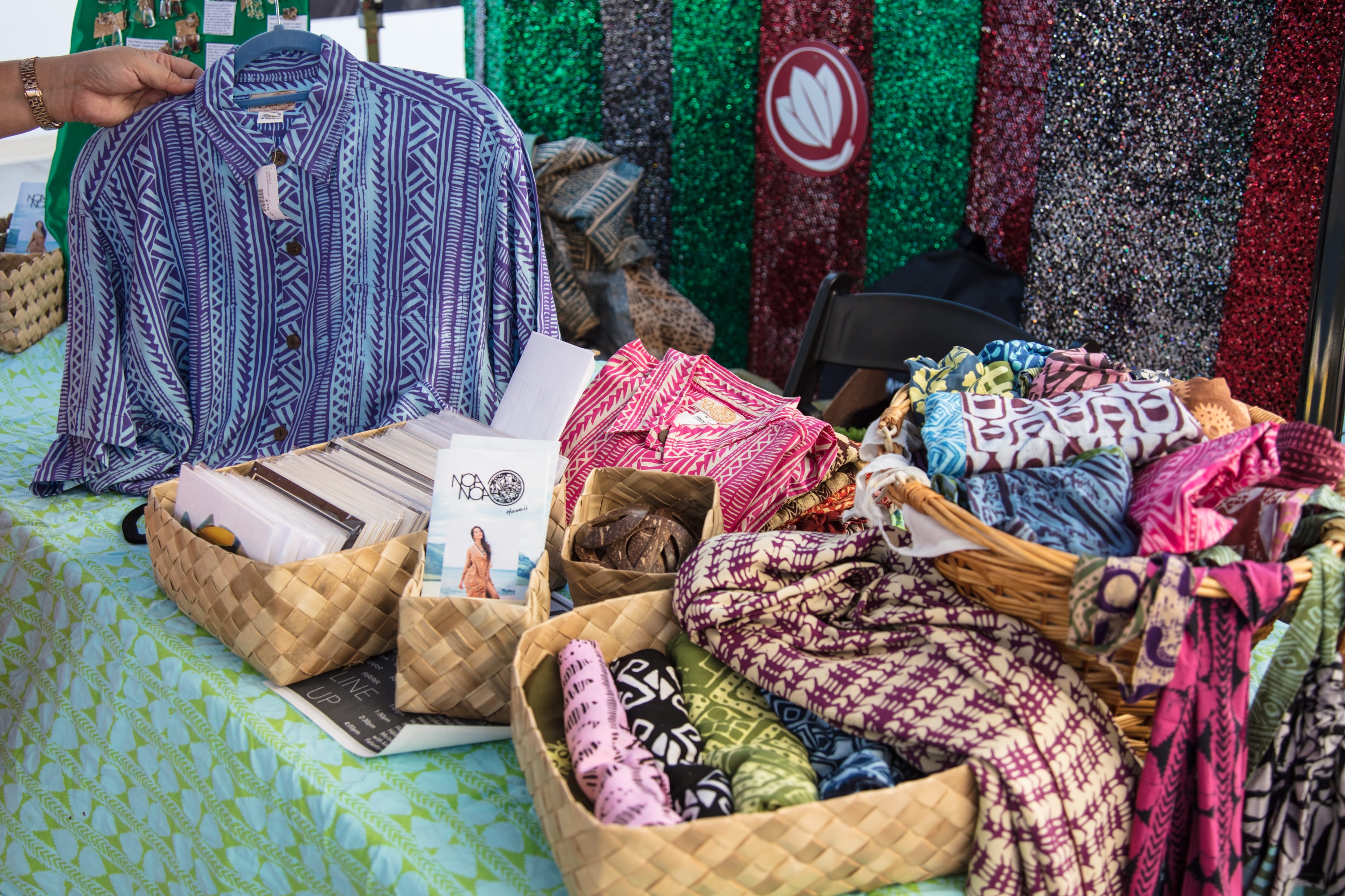 Colorful patterned clothing market stall display
