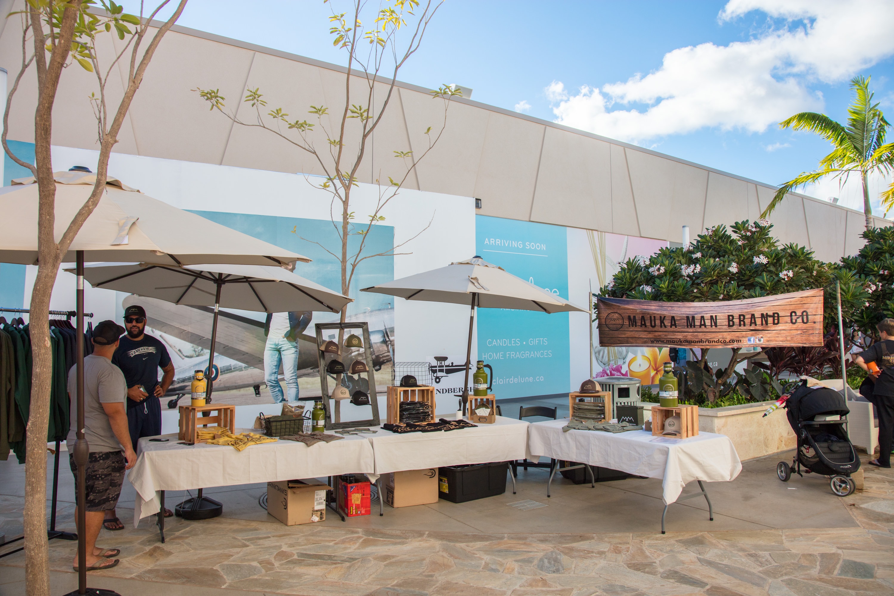 Outdoor market vendor stalls with umbrellas
