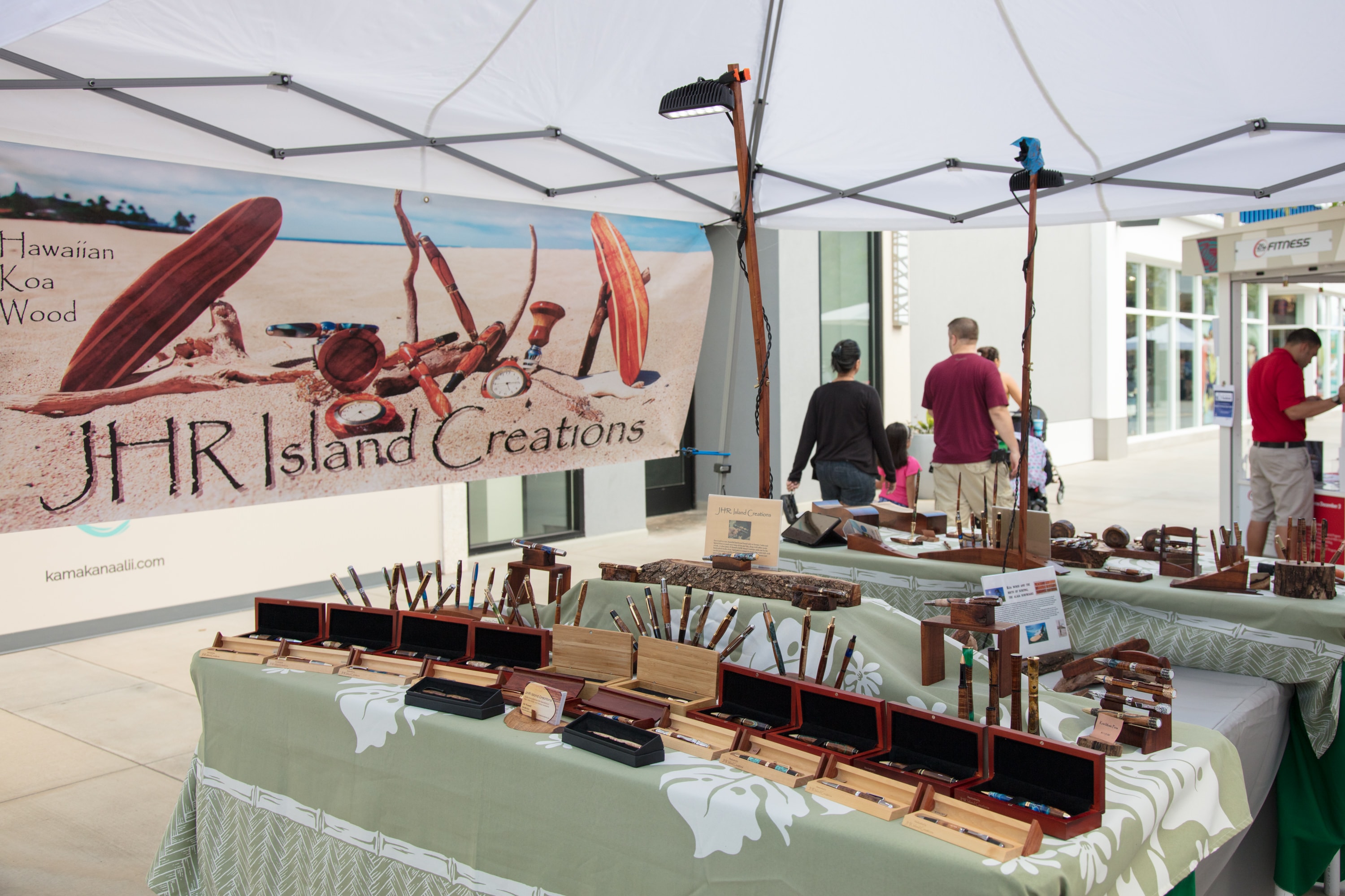 Hawaiian koa wood crafts market booth