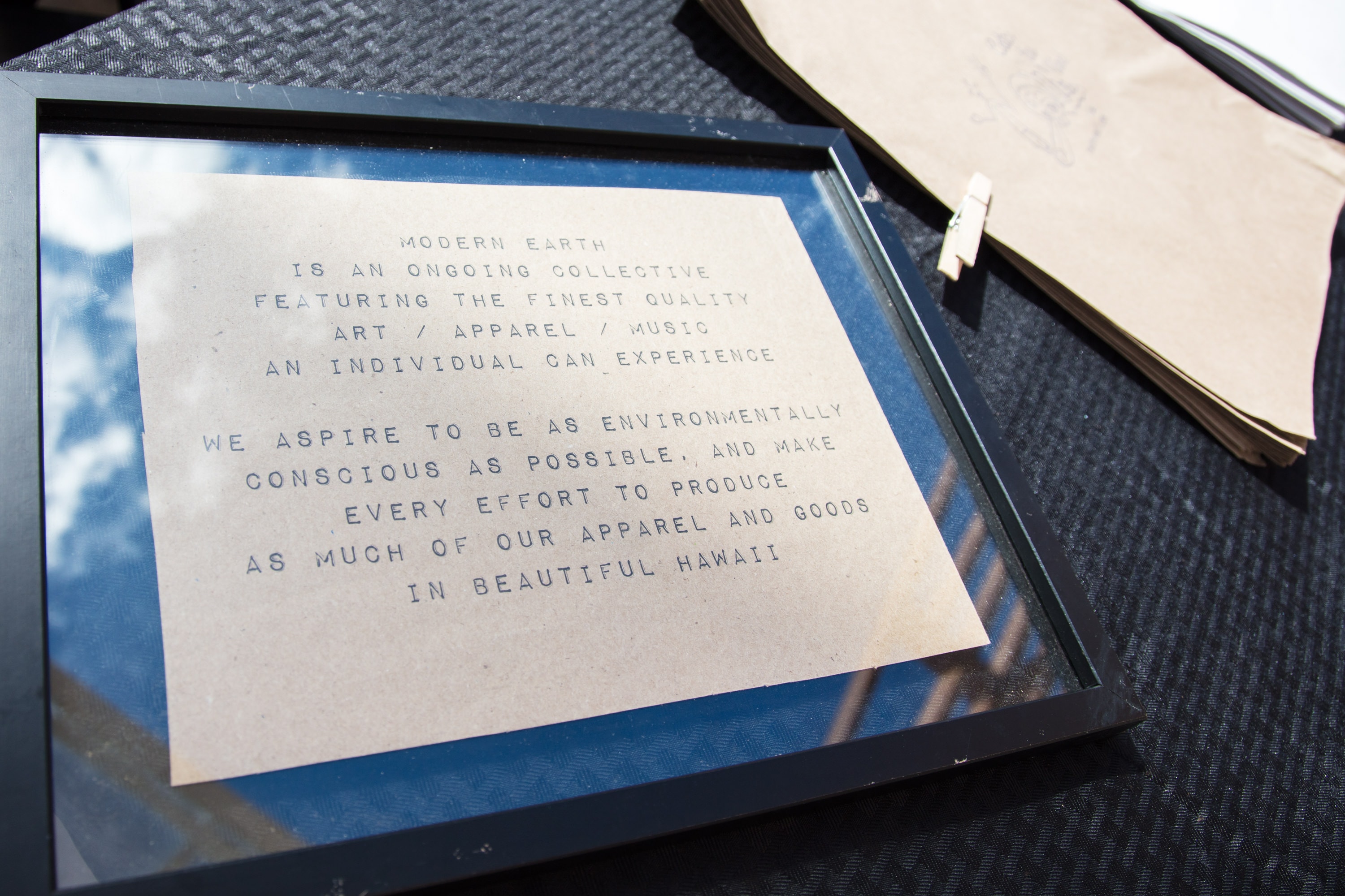 Framed text about Modern Earth Collective brand