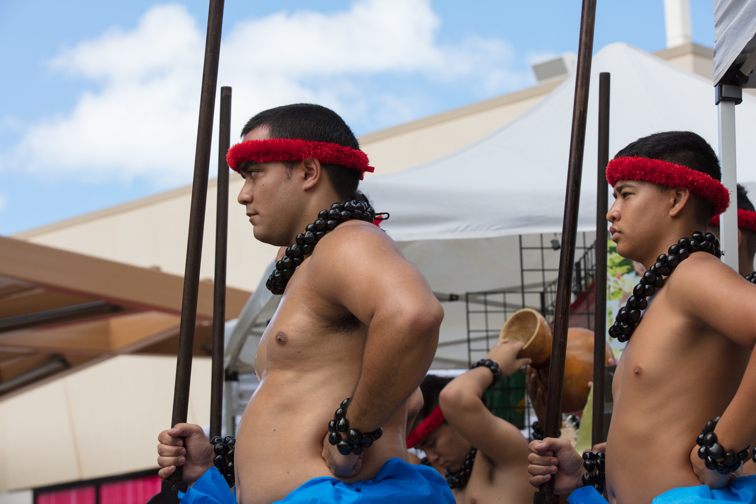 Indigenous men performing traditional spear dance