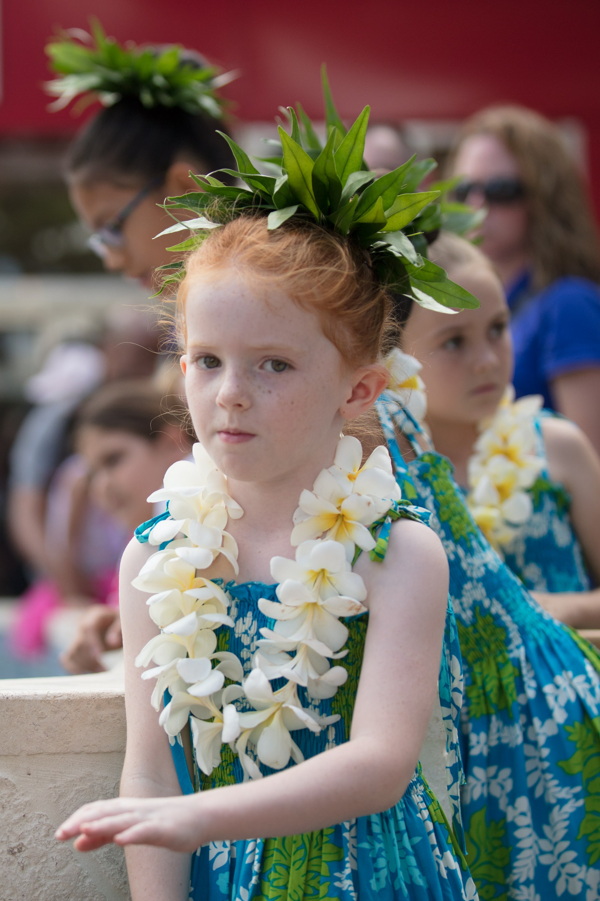 Child wearing Hawaiian lei flower crown