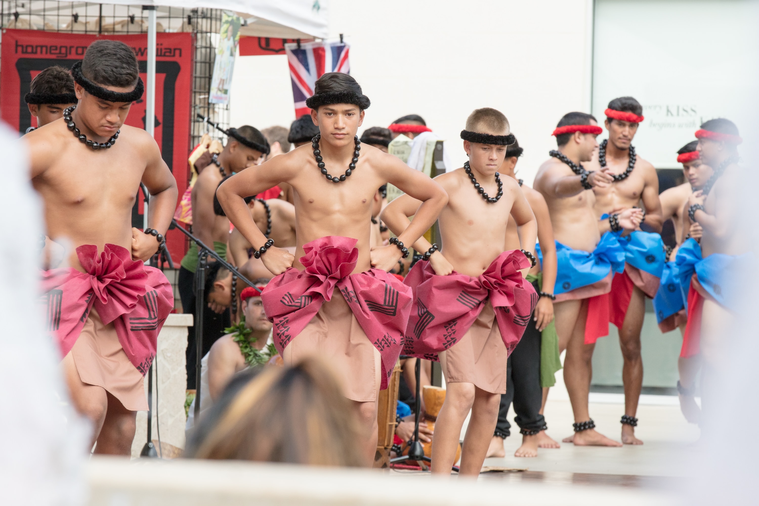 Maori youth performing traditional haka dance