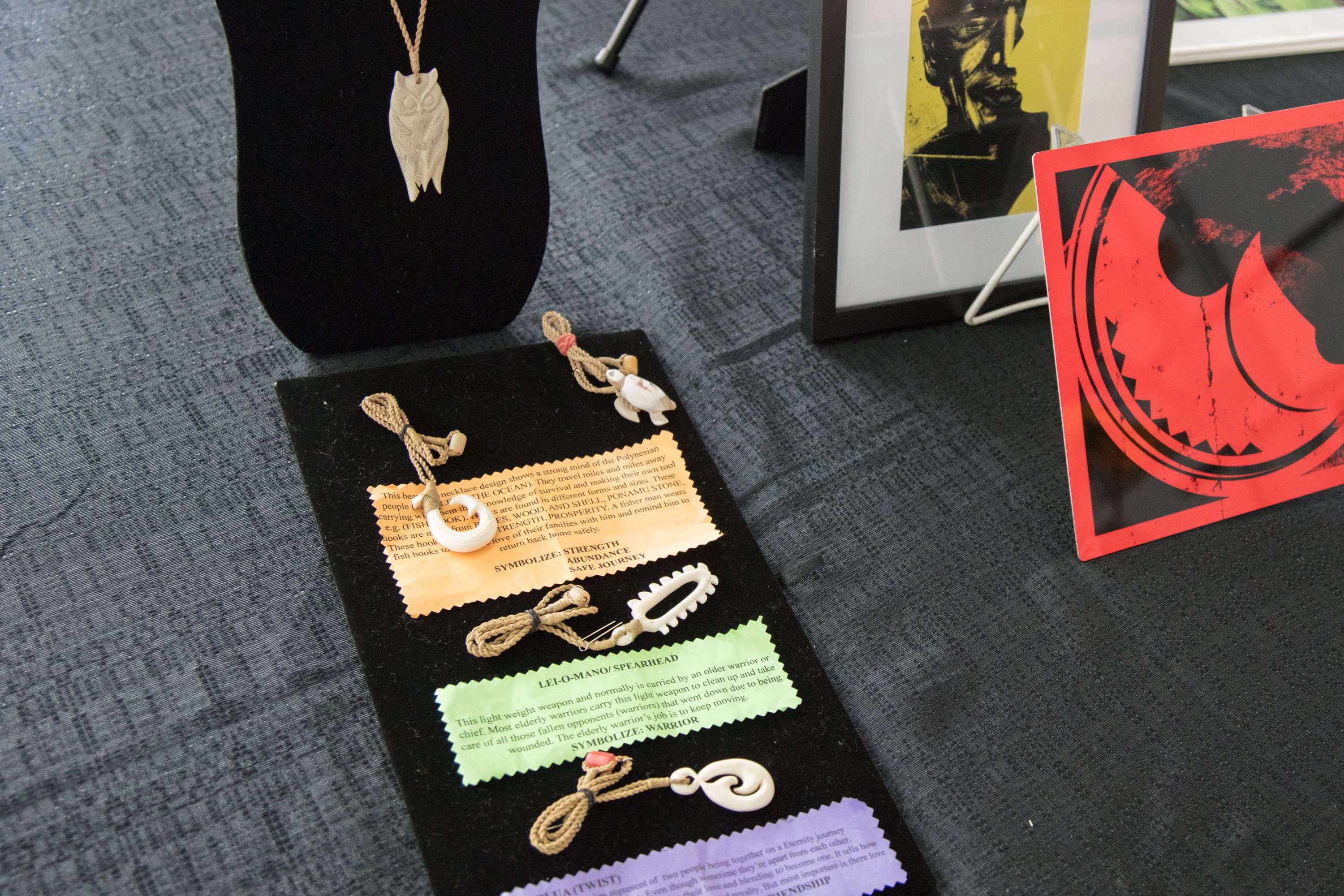 Bone pendant necklaces display with information card