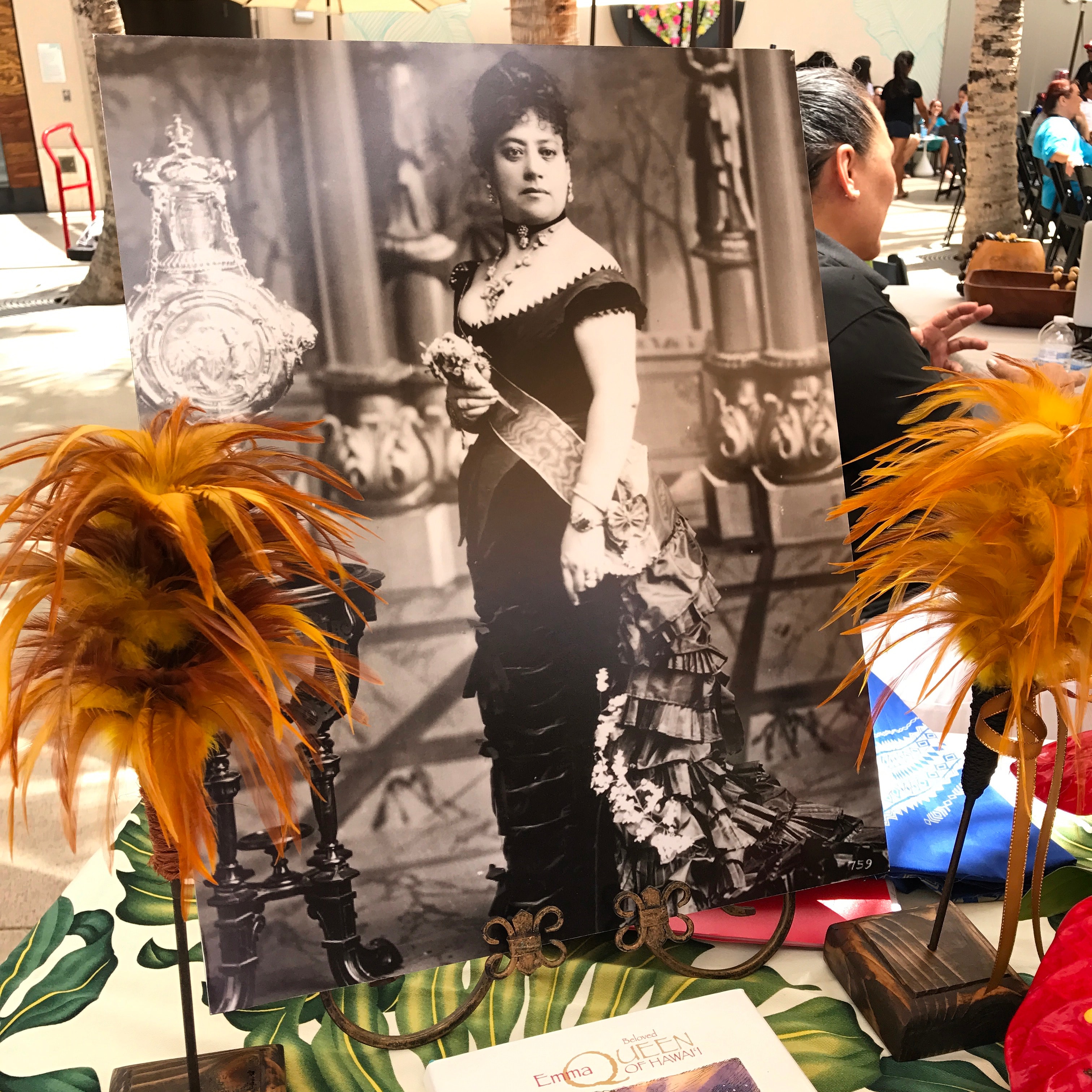 Vintage portrait display with orange feathers